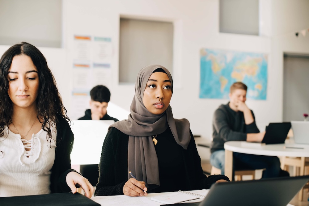 Students listening in class during lecture at university