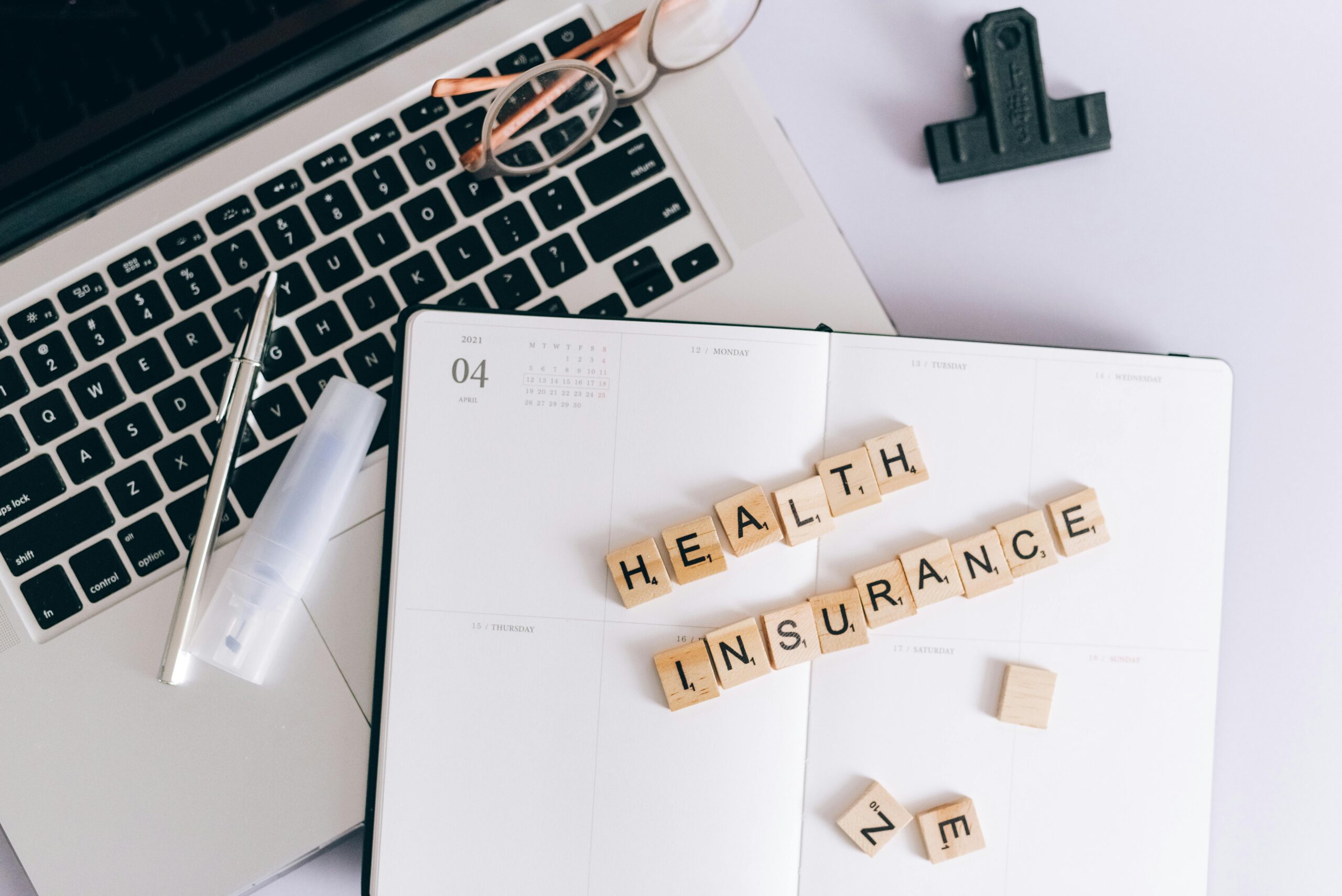 notebook that says health insurance